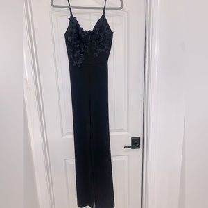 Black lace top jumpsuit. Size small. Worn once for a wedding.